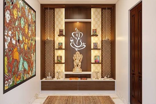 Wall-mounted Ganesh mandir with decorative artwork